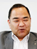 写真: システムセンター 専任役 小佐井 隆氏